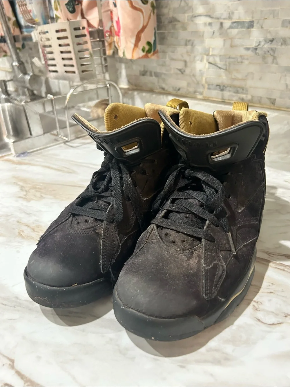 Jordan Black and Metallic Gold High-Top Sneakers